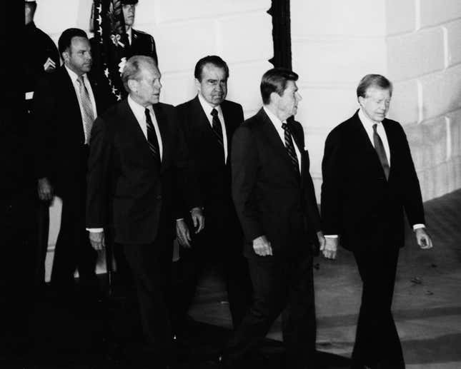 President Ronald Reagan (front, left) and former Presidents Jimmy Carter (front, right), Richard Nixon (back, right) and Gerald Ford (back, left) pictured leaving the White House as the former Presidents prepare to attend the funeral of Egyptian President Anwar Sadat, Washington DC, October 1981.