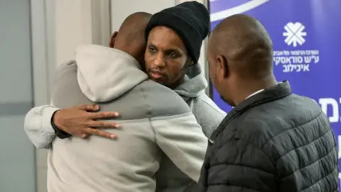 Reuters Image shows Avera Mengistu, who entered Gaza around a decade ago and had been held there since, hugging his family members after being released as part of hostages-prisoners swap on February 22, 2025