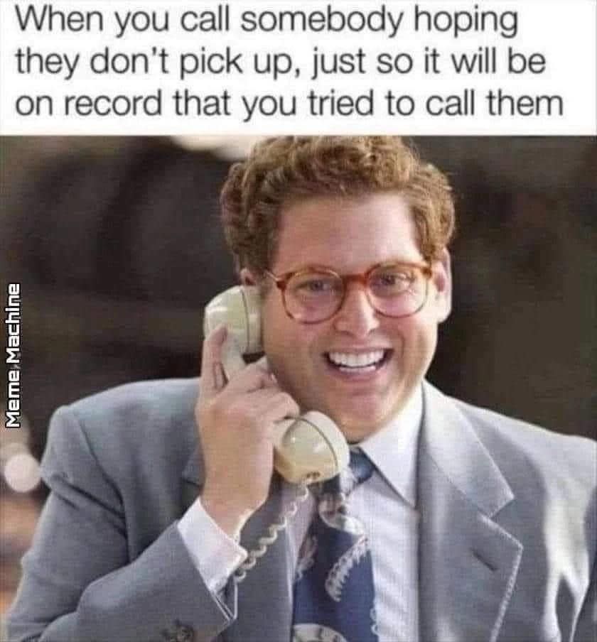 Person in a suit smiling while holding a phone. Text reads: "When you call somebody hoping they don't pick up, just so it will be on record you tried."
