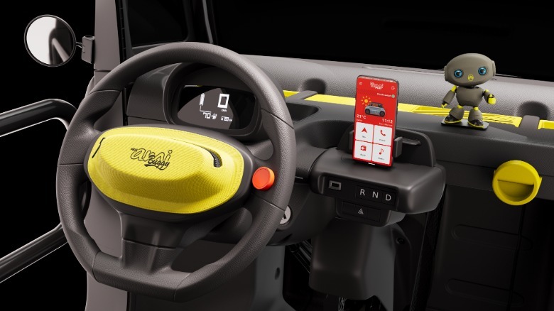 interior view of the Buggy with yellow inserts and Andy on the dash