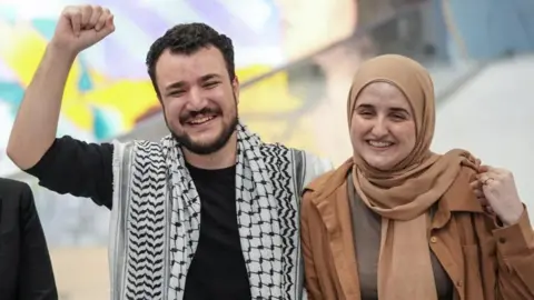 Reuters Khalil with a keffiyeh and his wife