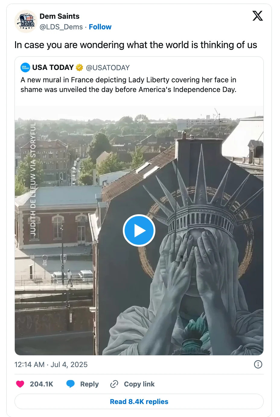 Mural in France shows Lady Liberty covering her face, unveiled before U.S. Independence Day; caption questions global opinions on America