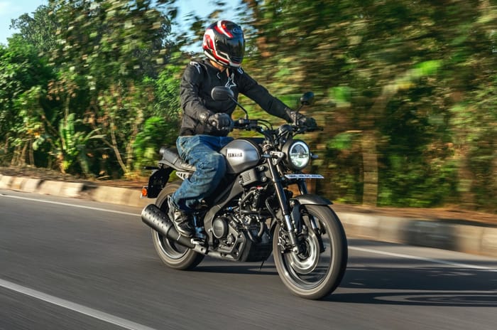 Yamaha XSR155 front right side riding shot on road